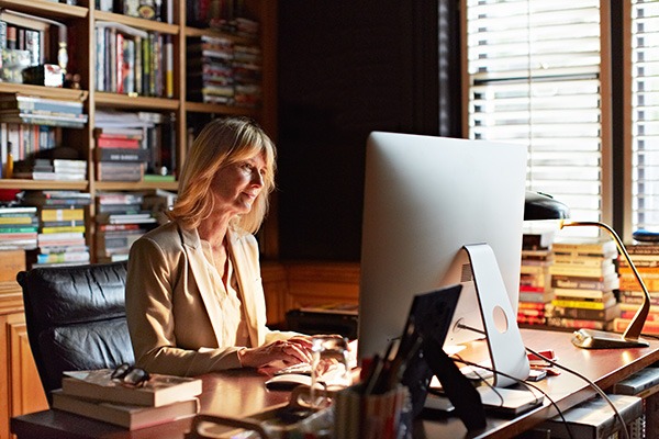 Professional woman at computer in her office