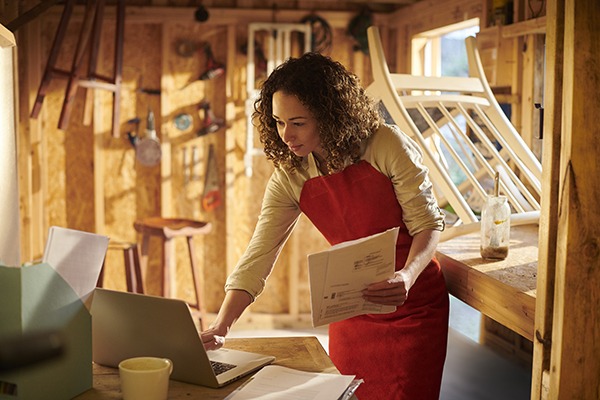 a small business owner recycling furniture from her garden workshop